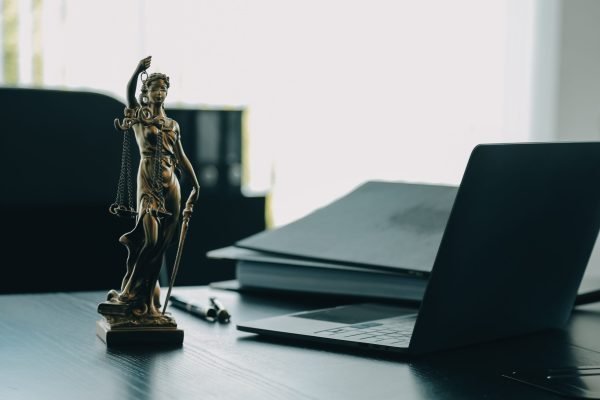 Judge gavel with Justice lawyers having team meeting at law firm background. Concepts of Law and Legal services.